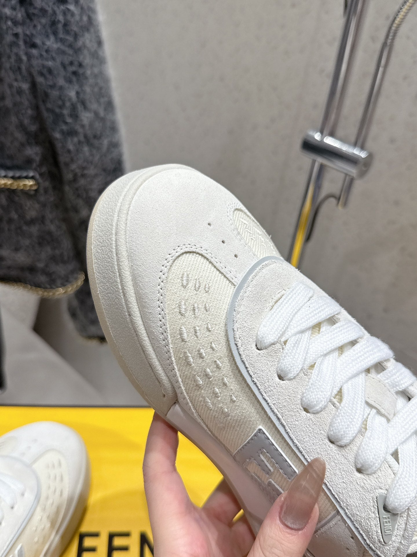 Fendi unisex sneakers, white leather, close-up of heel and tread with logo