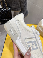 Fendi unisex sneakers, white leather, close-up of side panel with logo detail