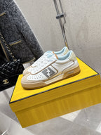 Fendi unisex sneakers with white uppers and beige side trim, lace-up with logo detail
