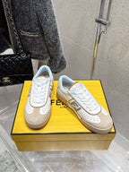 Fendi unisex sneakers on display: white leather-look with beige outsole, lace-up
