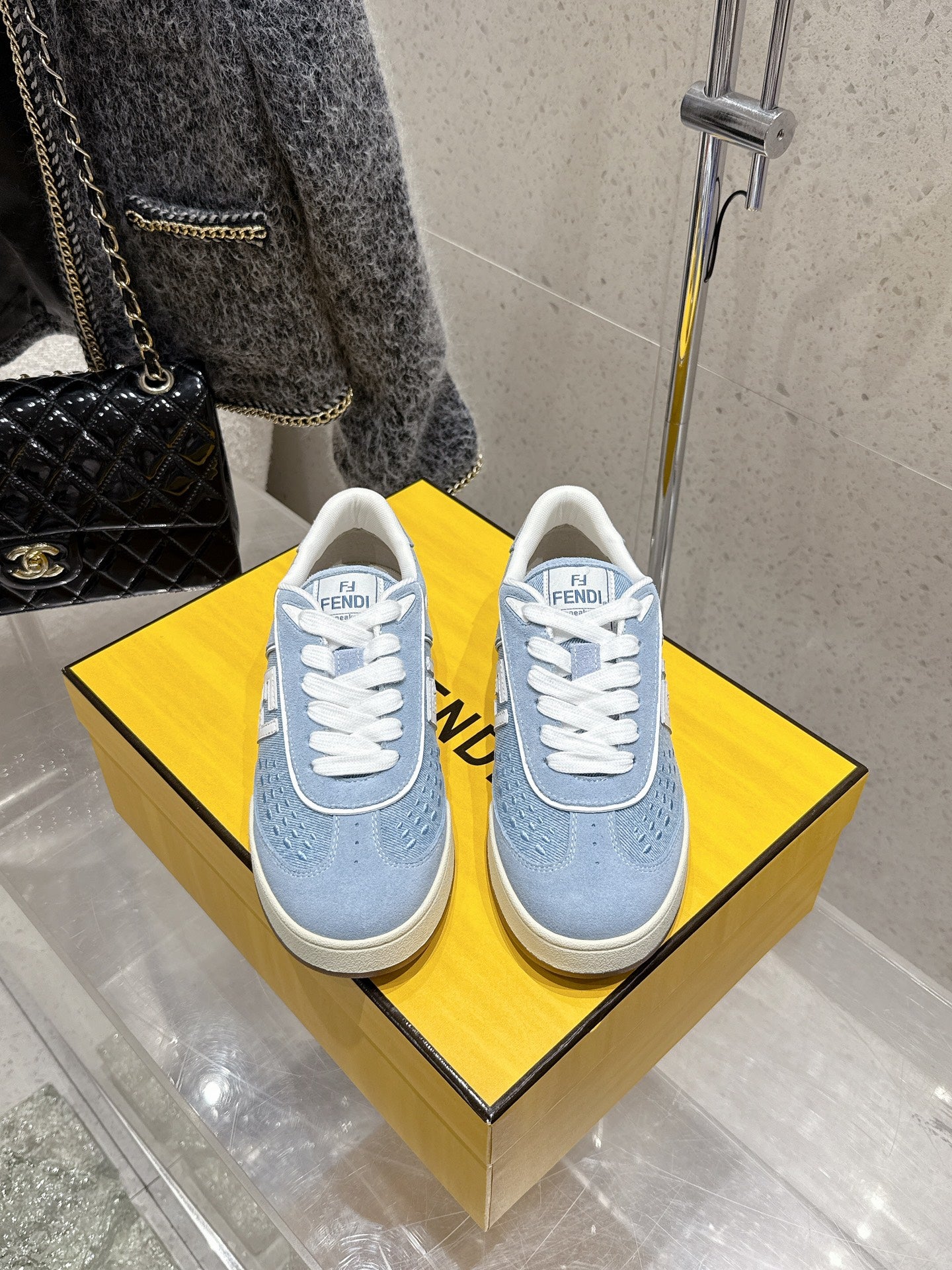 Light blue Fendi unisex sneakers with white laces and beige rubber sole