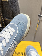 Close-up of light blue Fendi sneaker side with textured panel and white laces