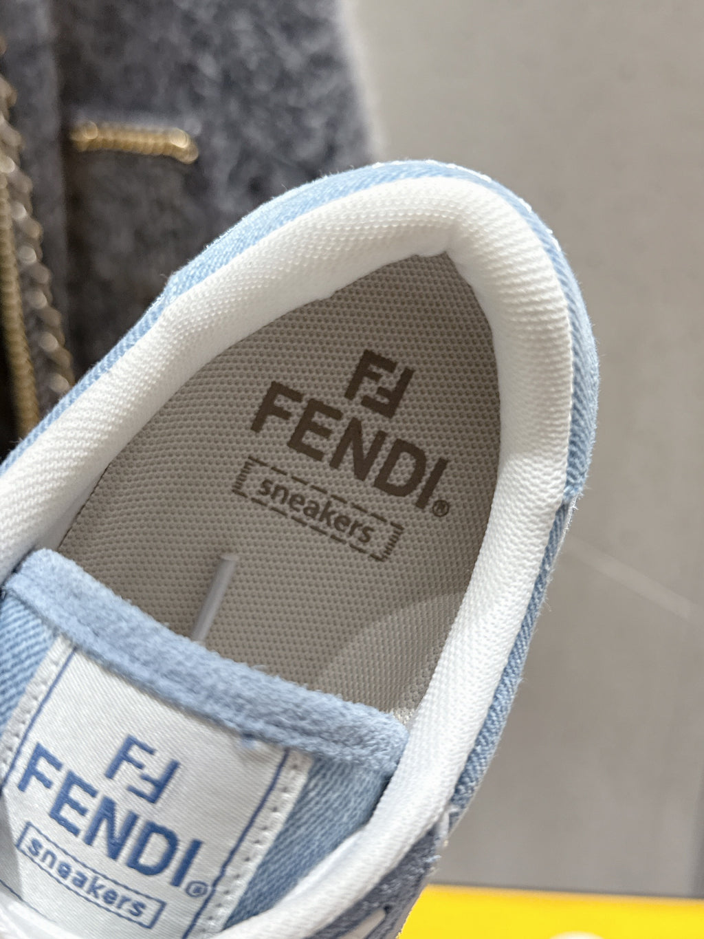 Fendi sneaker insole with 'FENDI' and 'Sneakers' print, light blue lining
