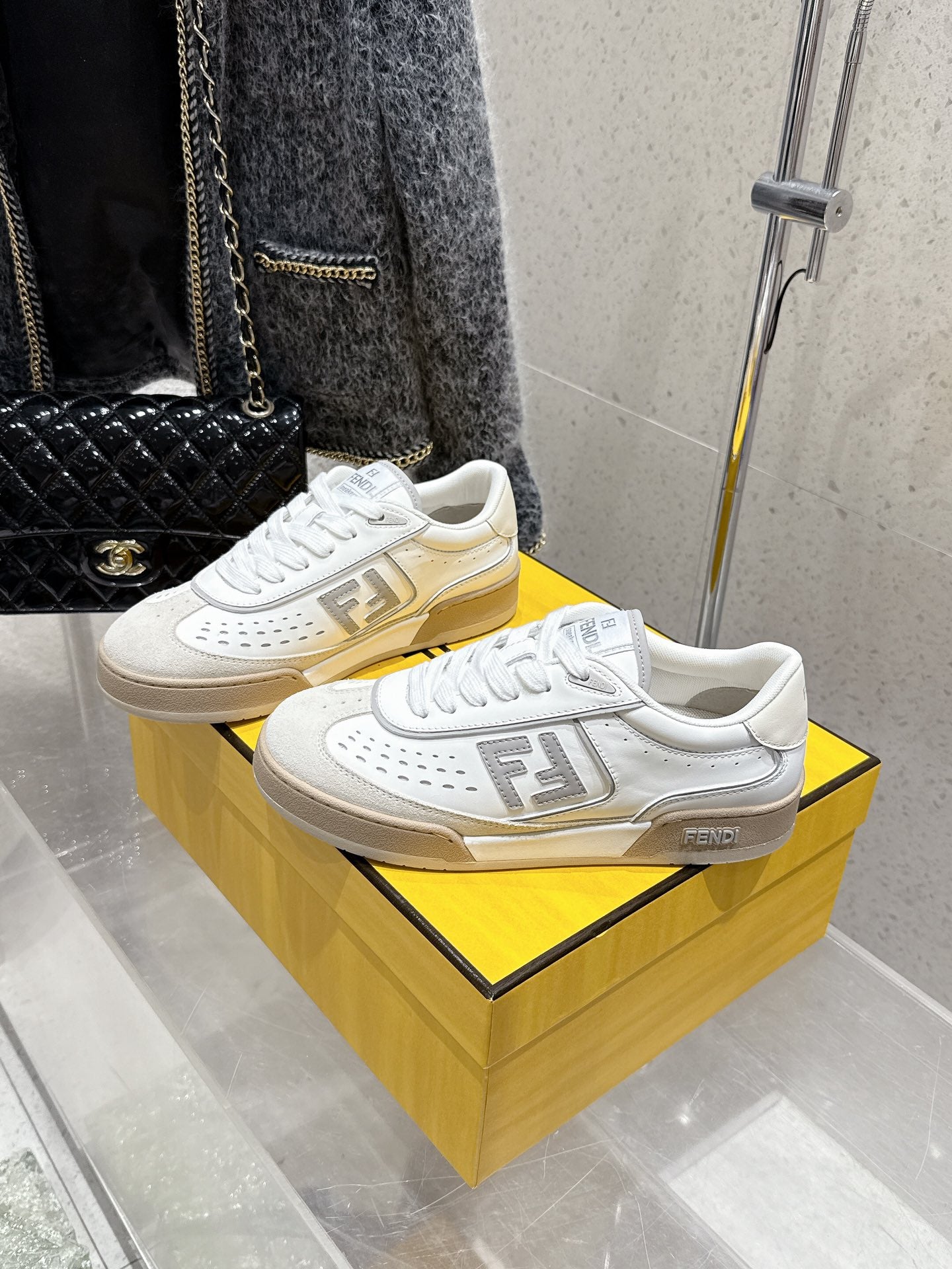 White Fendi sneakers with FF strap detail and beige gum sole