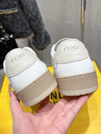 White Fendi sneakers back view, FENDI Roma heel text and beige sole