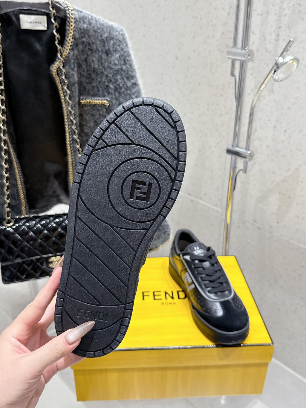 Fendi unisex sneaker outsole and heel, black tread with FENDI marking and logo