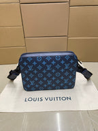 Blue monogram crossbody bag with rounded shape and zipper closure