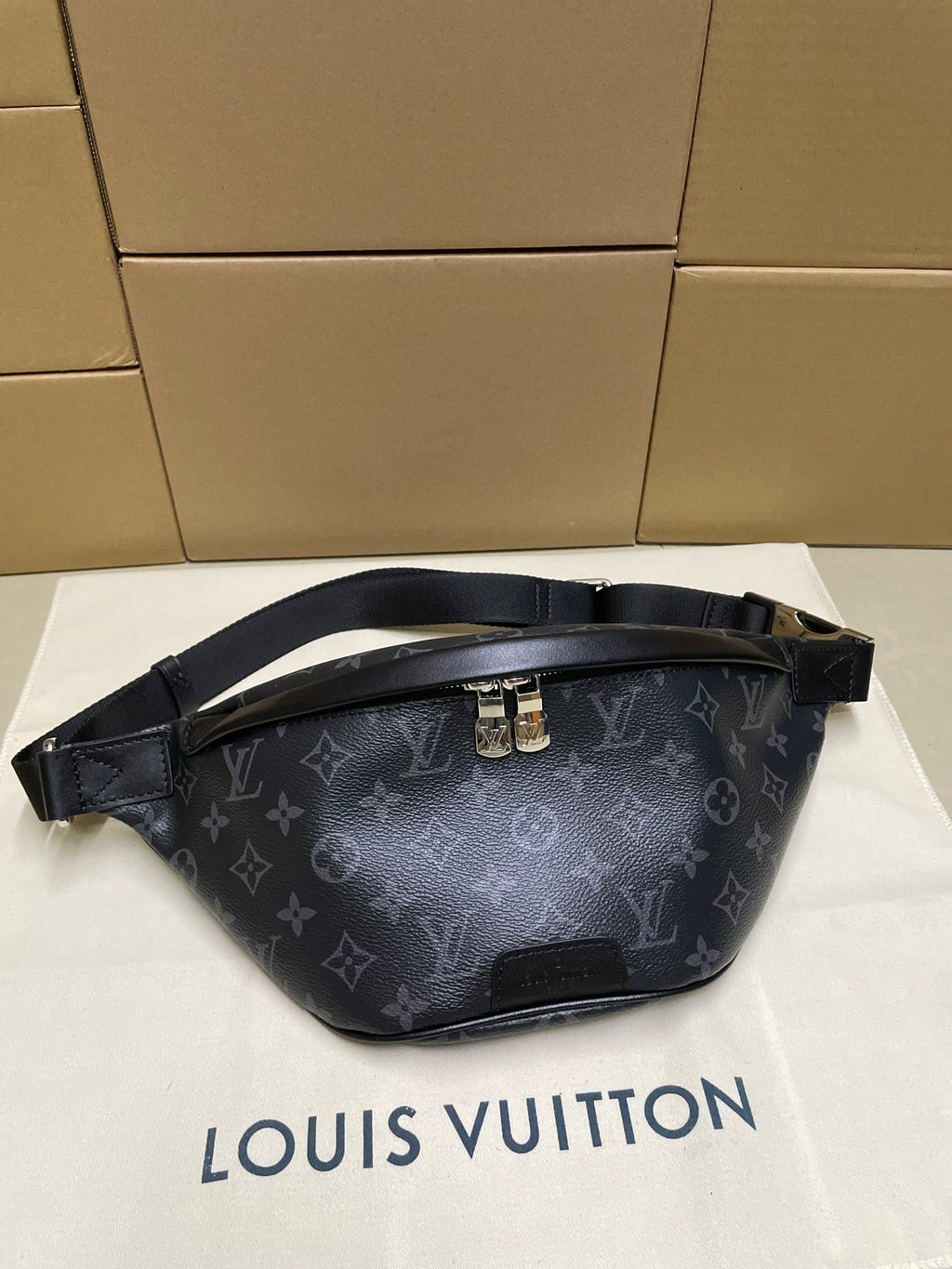 Louis Vuitton monogram waist bag in dark navy with adjustable strap and top zipper