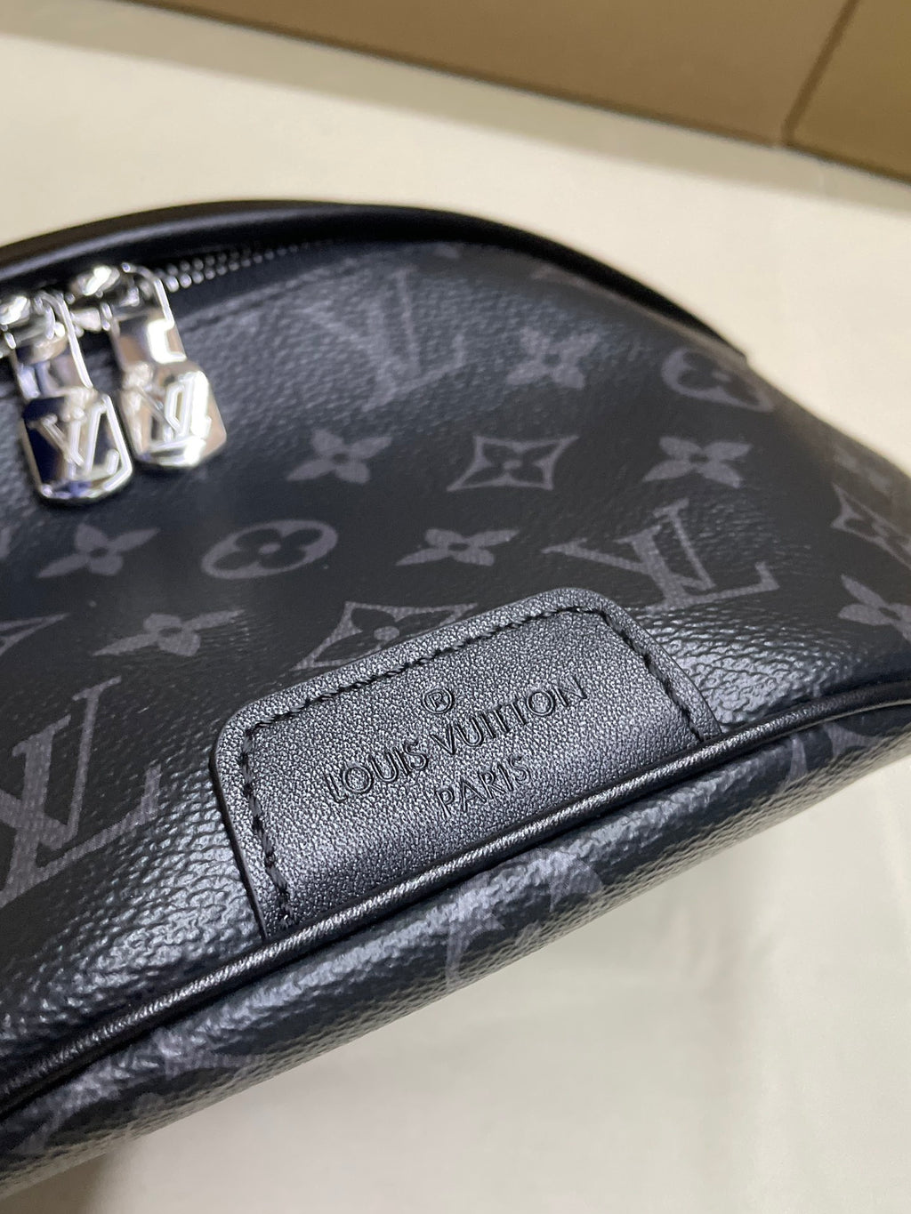 Louis Vuitton monogram waist bag, embossed logo patch and textured leather trim