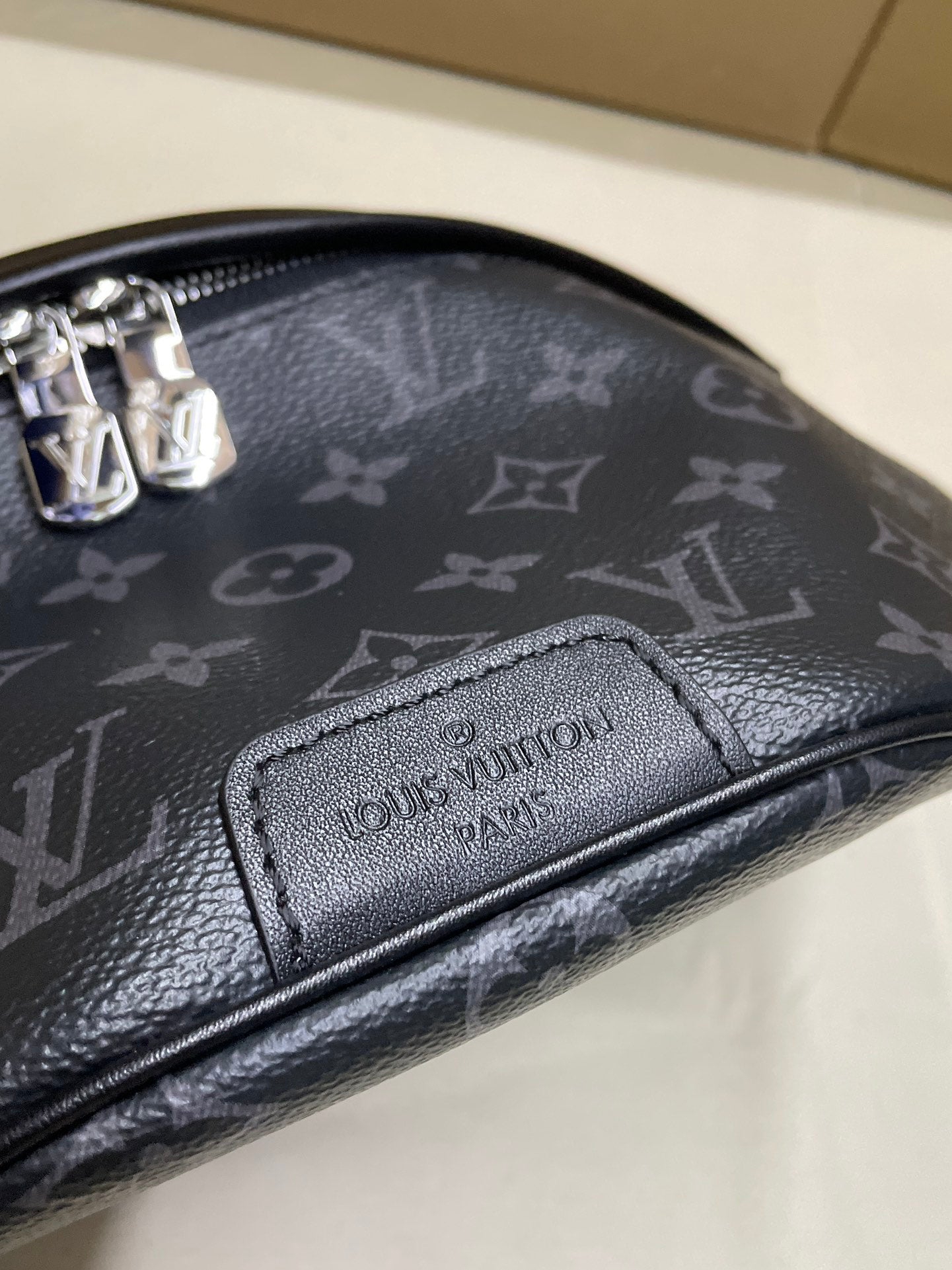 Louis Vuitton monogram waist bag, embossed logo patch and textured leather trim