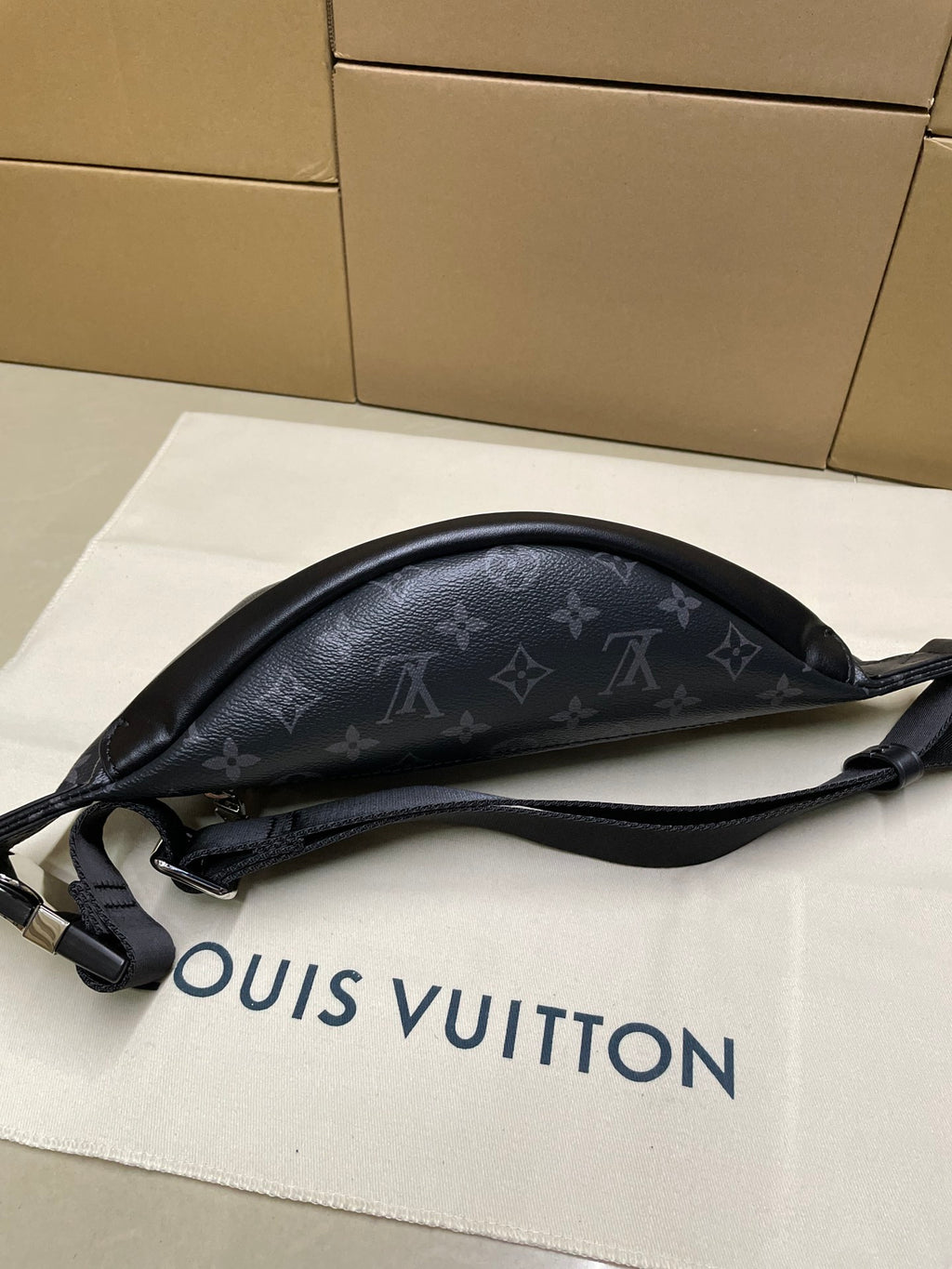 Louis Vuitton monogram waist bag in dark navy, wide strap and curved silhouette