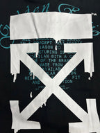 Black graphic T-shirt with white emblem and teal background text behind it.