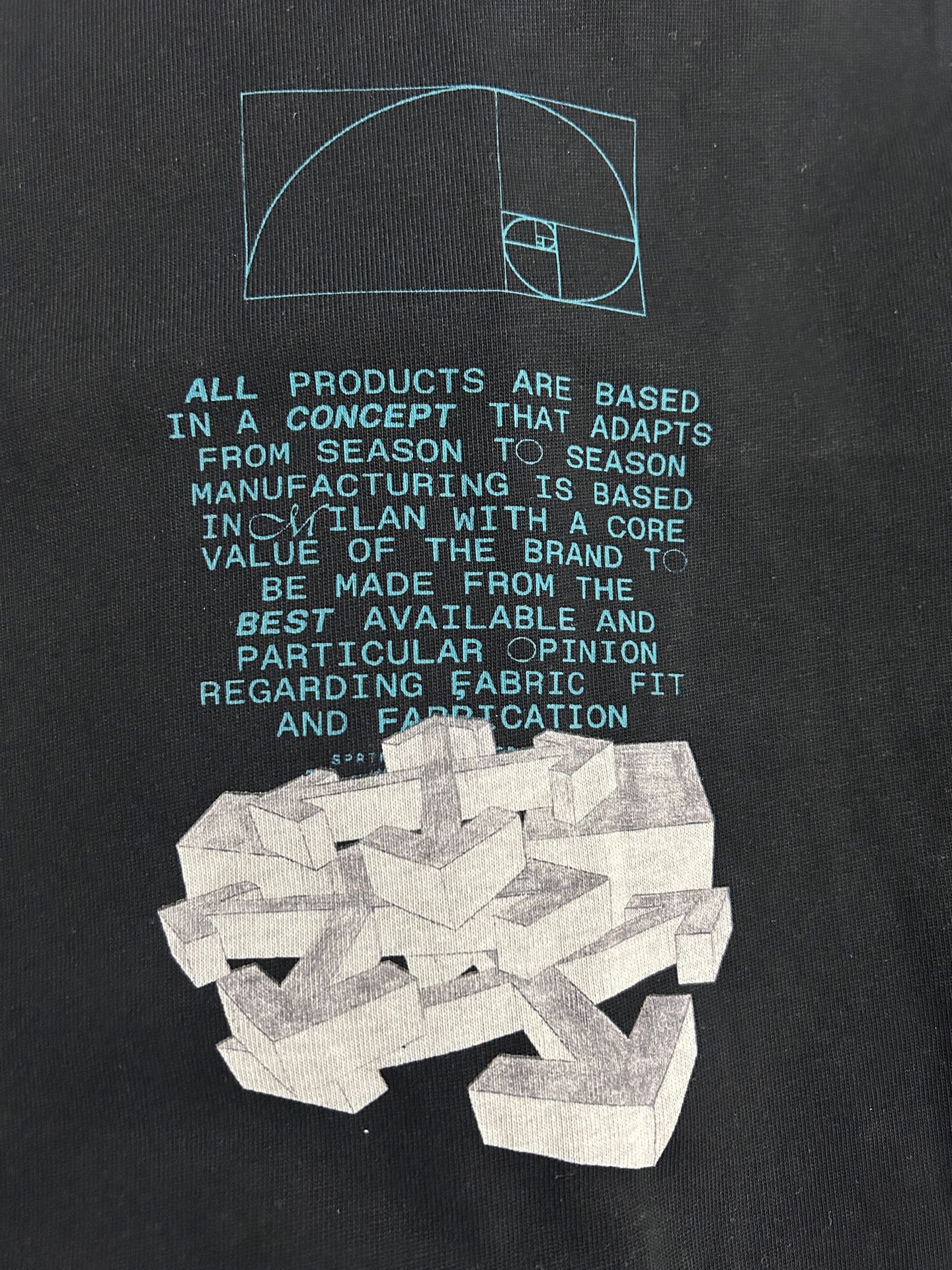 Black graphic T-shirt with teal outline text and a white layered emblem.