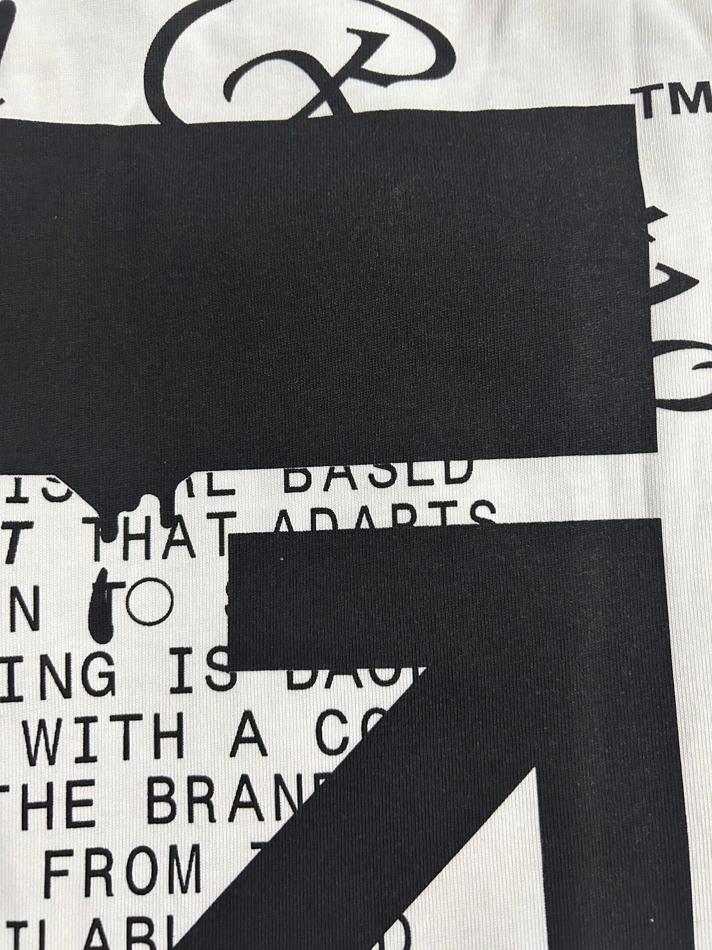 Off White graphic T-shirt close-up, white with black square and partial text
