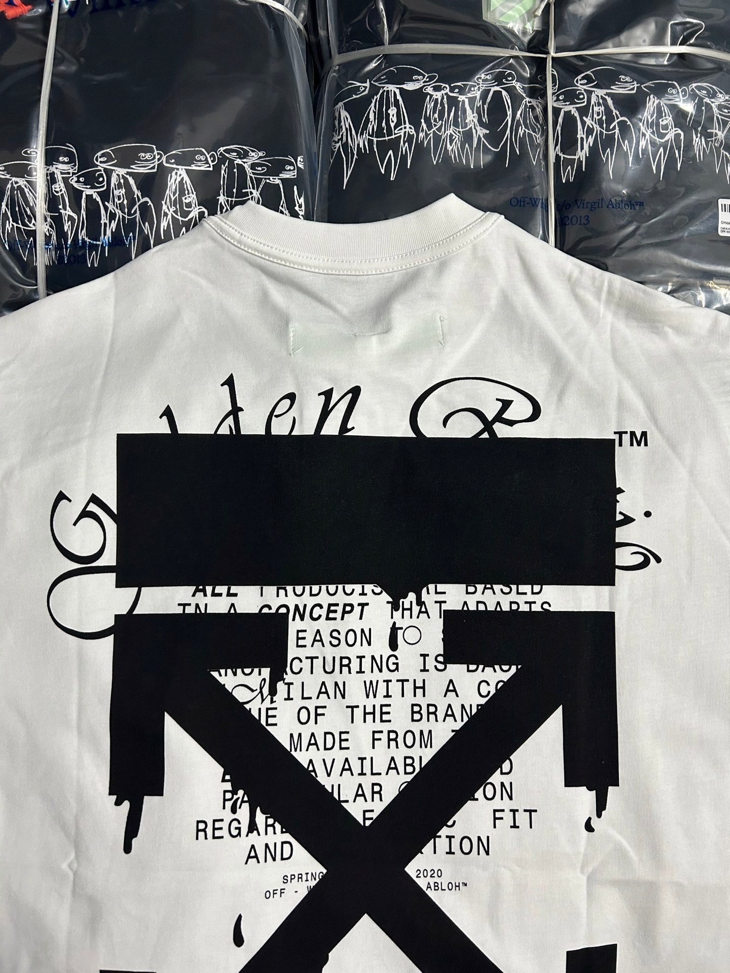 Off White off-white T-shirt close-up of black logo X and text print