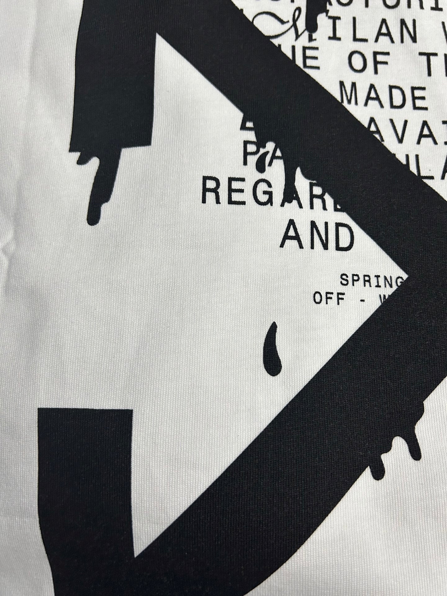 Off White graphic T-shirt close-up, white with black arrow/line graphic