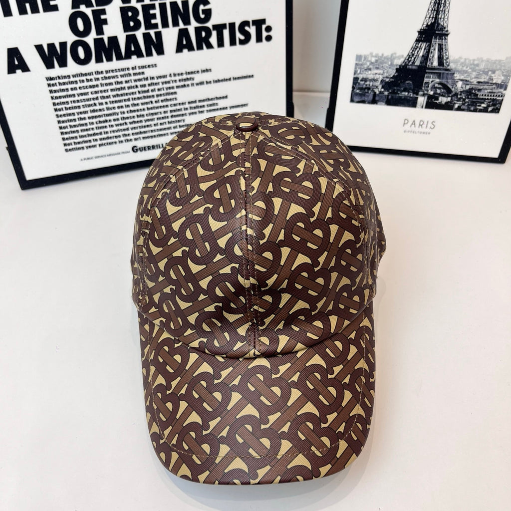 Burberry cap with brown-and-tan monogram pattern, curved brim