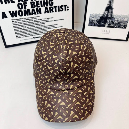 Burberry cap with brown-and-tan monogram pattern, curved brim