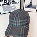 Burberry plaid cap front view with curved brim and center seam