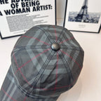 Burberry plaid cap side view with top button and curved brim