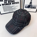 Burberry plaid cap with round top button and curved brim