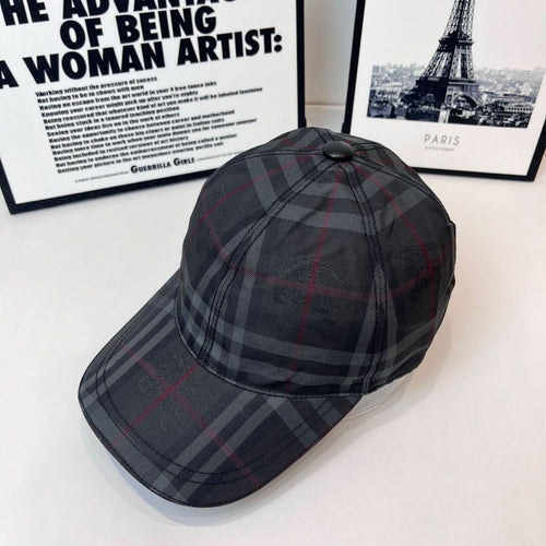 Burberry plaid cap with round top button and curved brim