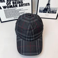 Burberry dark plaid cap with curved brim and stitched crown panels