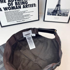 Burberry cap interior with hanging tag and stitched lining