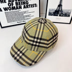 Burberry plaid cap in olive, black, and yellow checks, side view and crown button