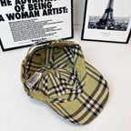 Burberry plaid cap angled view, olive with black and yellow plaid, curved brim