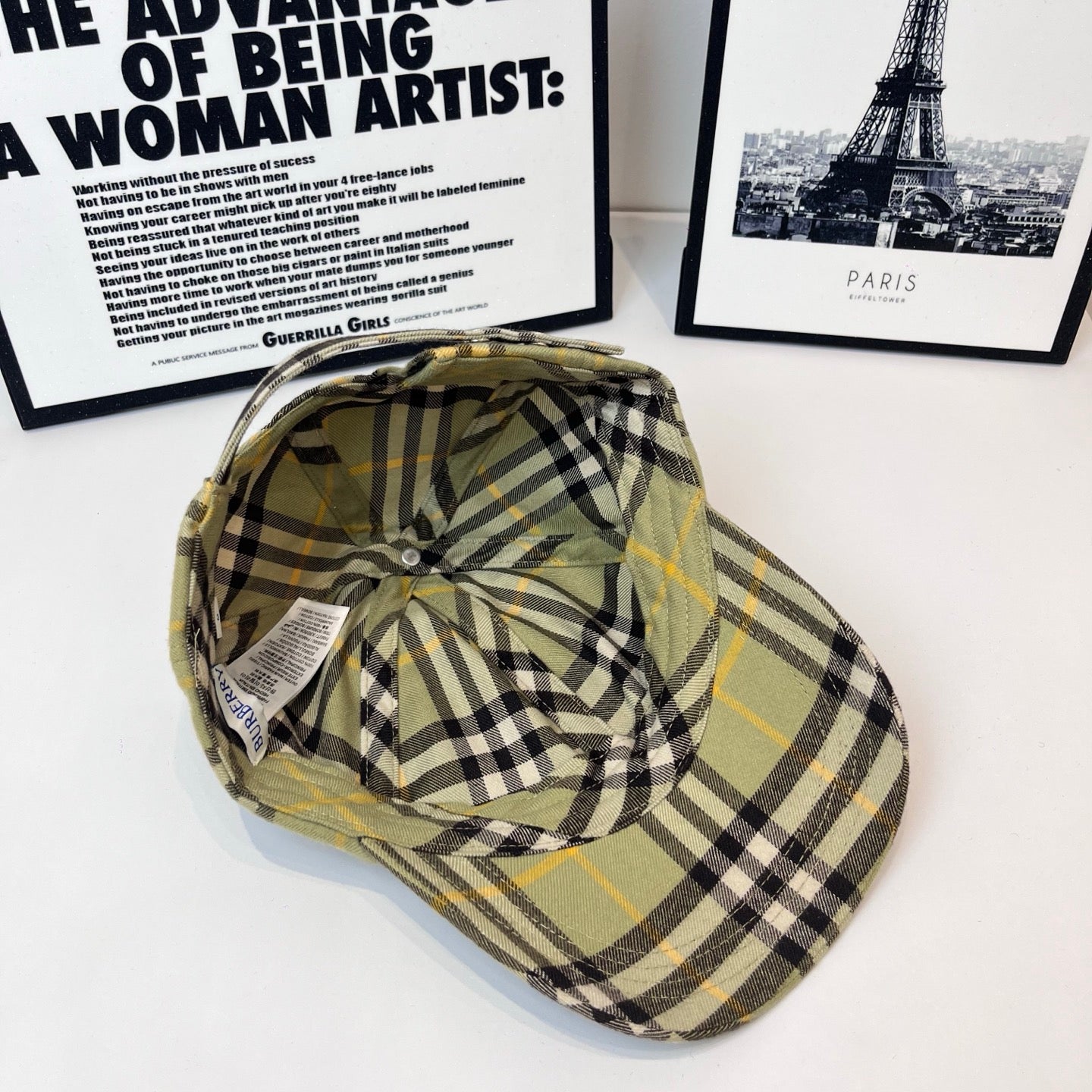 Burberry plaid cap angled view, olive with black and yellow plaid, curved brim