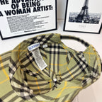 Burberry plaid cap interior with brand label tag, olive with black and yellow checks