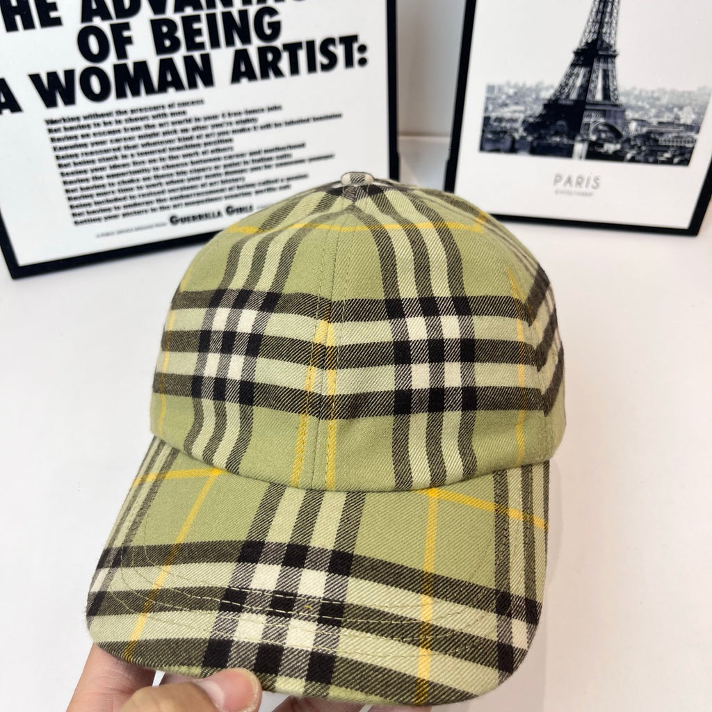 Burberry plaid cap close view, olive with black-and-yellow checkered crown and brim