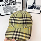 Burberry plaid cap close view, olive with black-and-yellow checkered crown and brim