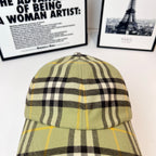 Burberry plaid cap top view, olive plaid with black checks and yellow accents