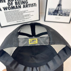 Mesh cap lining with yellow logo patch centered on inner panel