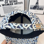 Burberry cap underside with navy-and-white B print, black interior and brim lining