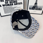 Burberry cap interior view with black lining and navy-and-white B logo outer crown