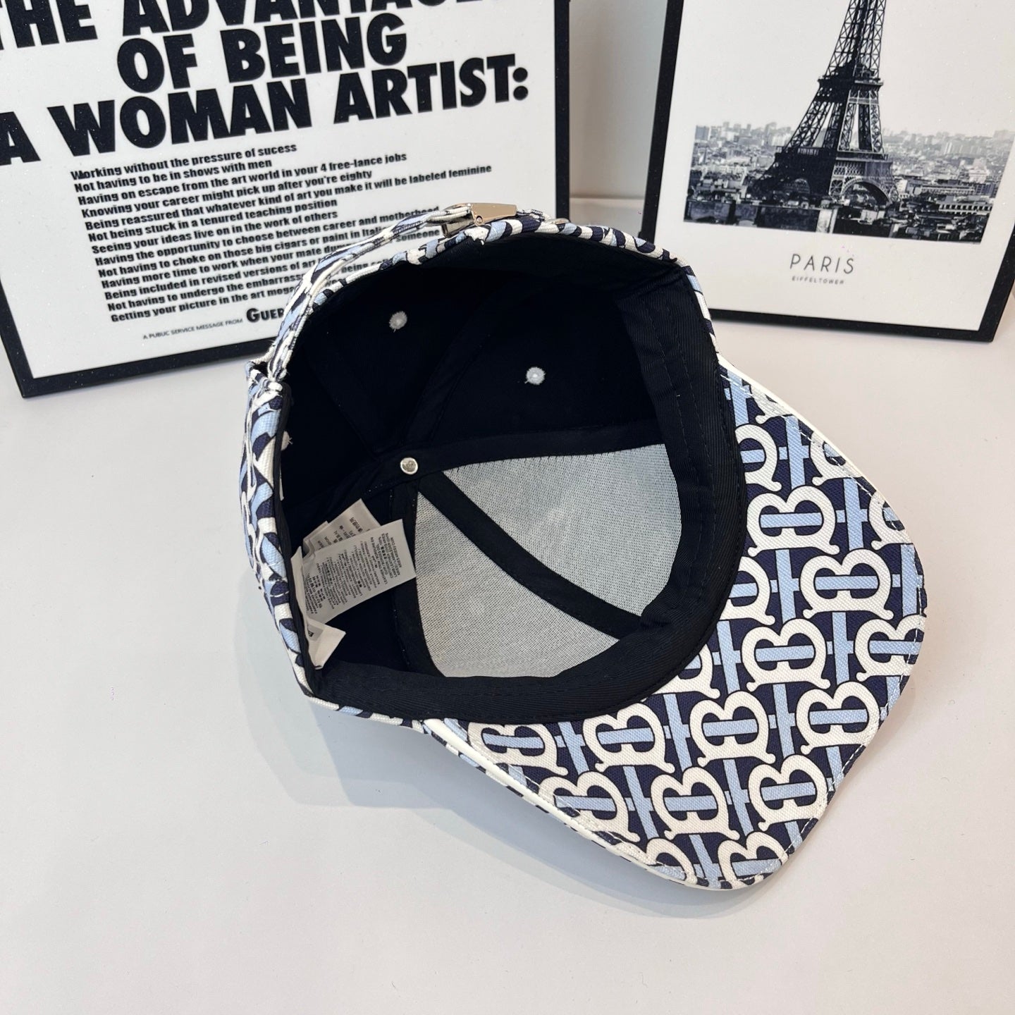 Burberry cap interior view with black lining and navy-and-white B logo outer crown