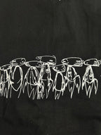Black T-shirt with white illustrated line art figures along the chest