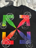 Black T-shirt with colorful geometric print featuring white orbit-line circles