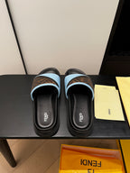 Pair of blue slide sandals with brown FF-logo straps and black rubber soles