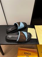 Blue slide sandals with brown FF-logo strap, black molded footbed, FENDI text