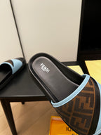 Blue slide sandal top view with brown FF-logo strap and black footbed, FENDI