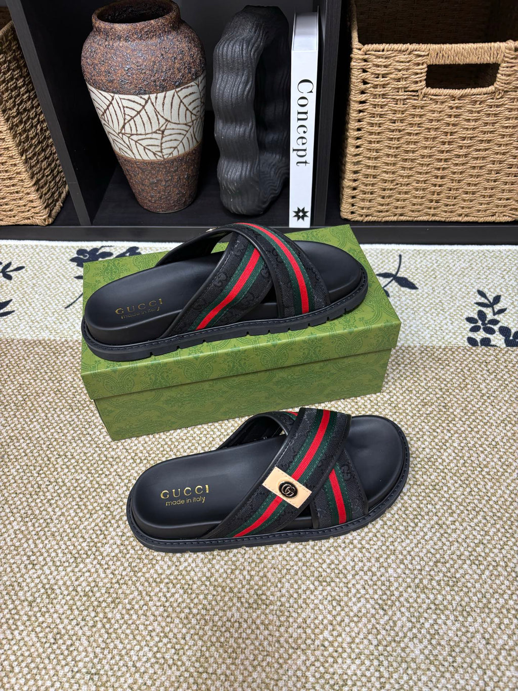 Gucci black slide sandals with curved strap and green red web band
