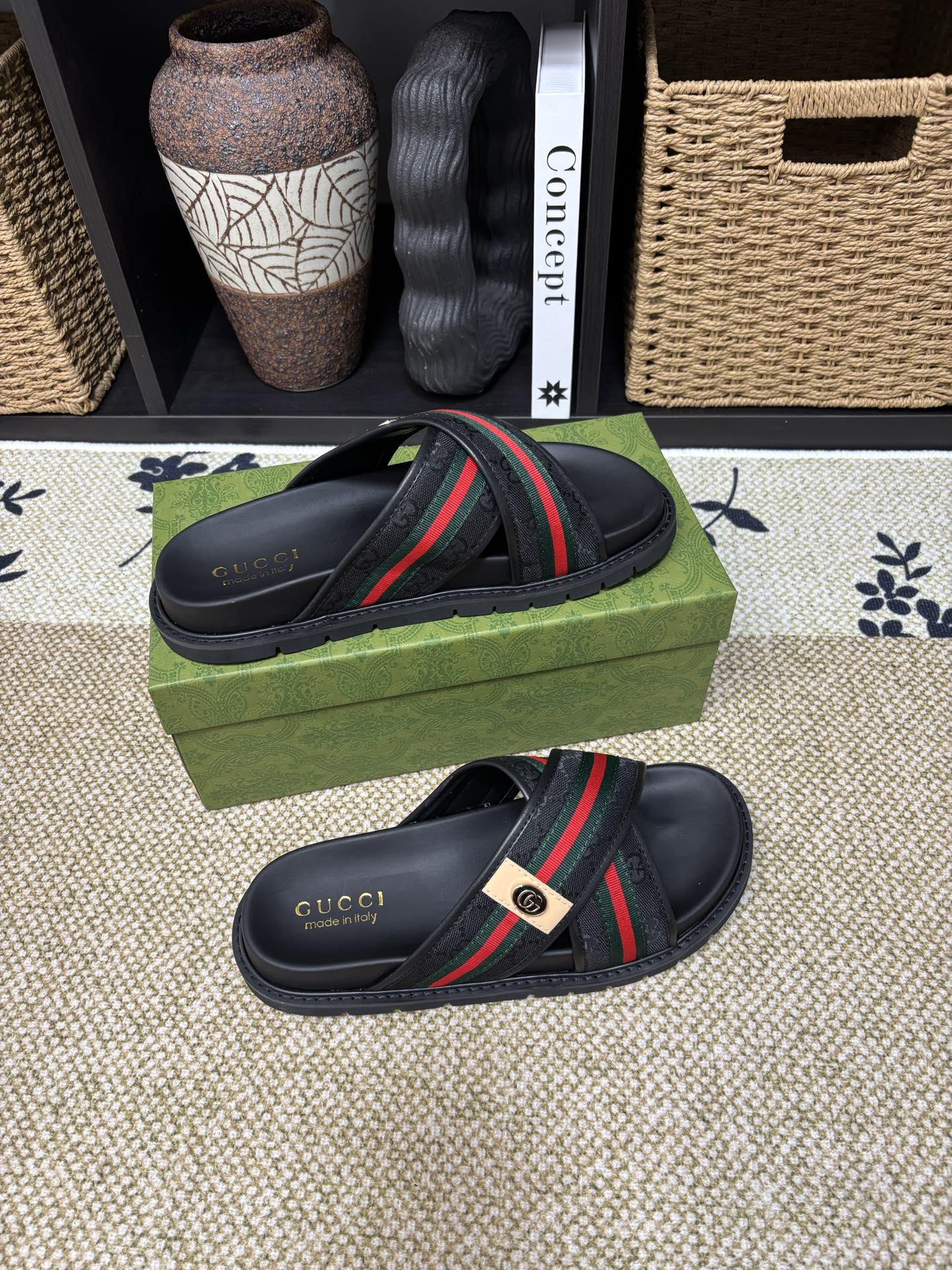 Gucci black slide sandals with curved strap and green red web band