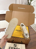 Metallic low-top sneakers with white laces, front and outsole views, Fendi branding