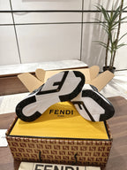 Navy and white FENDI sneakers with textured outsoles and contrasting heel panel