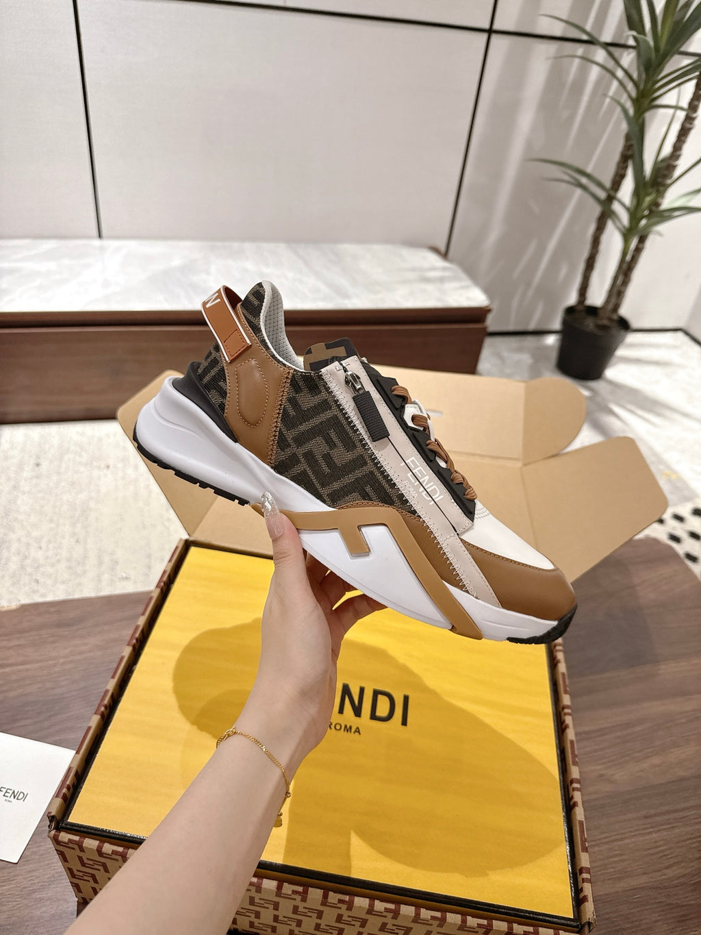 Fendi unisex sneakers in brown, black, and white with lace-up front and rubber sole