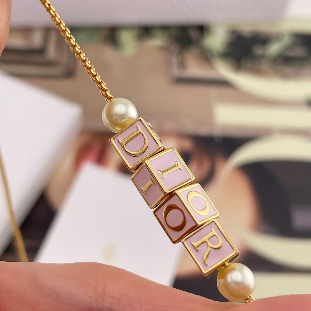 Gold-tone Dior letter charm bracelet with pearl bead and chain
